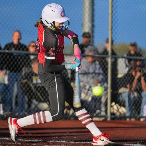 Although by no means a 1-girl gang, 2025 Chillicothe High School softball Lady Hornets junior pitcher Landry Marsh proved hard for Savannah to handle when she batted in this past Monday’s championship game of the Class 3 District 8 Tournament at Excelsior Springs. About to clout a low pitch hard and far over the left-center field fence for a 3-runs home run in the second inning, Marsh went three for three at bat with three RBI, three runs scored, two walks, and two stolen bases. In the bottom of the ninth inning, her second walk and second steal set up Hayden Hansen’s long single to deep left-center field to score the game-ending run in CHS’ 6-5 victory. After a slow start pitching, she also shut out Savannah over the final five innings to buy time for her team to get the winning run that sent Chillicothe into state-tournament play Saturday. (BUTCH SHAFFER/C-T PHOTO)