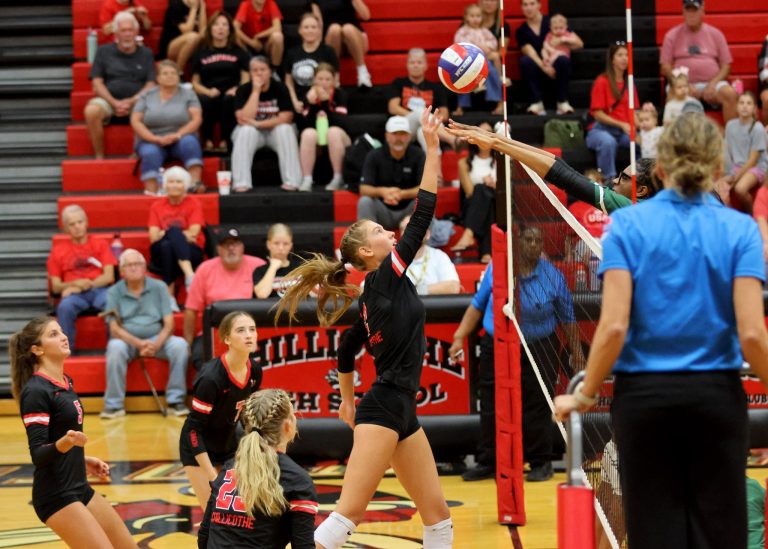 As teammates, her grandparents, and other fans of the record-setting 2025 Chillicothe High School volleyball Lady Hornets watch, senior right-hitter Lyla Beetsma thwarts a tall St. Joseph: Lafayette player’s over-the-net attempt to block her shot by, with a slight delay, tipping the ball softly over the extended arms for a winning shot during CHS’ Sept. 25 Midland Empire Conference victory. This past Monday night, the Lady Hornets earned a one-third share of this season’s MEC title with their sixth league win in a row, a 4-games victory at St. Joseph: Benton. It is the first conference crown in the sport in the Chillicothe program’s 32-seasons history. (JENNIFER SMITH/C-T FILE PHOTO)