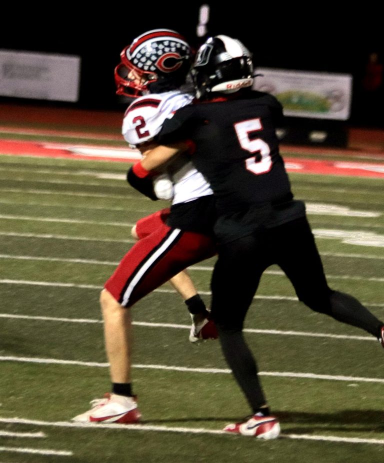 Senior wide receiver Oliver Perry secures a third-and-7 catch for a 9-yards gain and a first down late in the first quarter of last Friday’s 21-7 loss at Class 4, state-ranked Odessa. Perry later delivered a 66-yards punt in the third quarter, only eight yards shy of Dan Thompson’s 1980 school record. (PAUL STURM/C-T PHOTO)