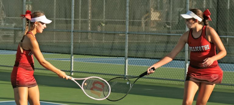 2025 Chillicothe High School tennis Lady Hornets Lexy Smith, left, and Lydia Bonderer touch racquet in fleeting celebration of winning a point during their Class 1 District 8 doubles championship match Oct. 10. The CHS tandem, each of whom took up the sport only at the start of the 2024 high school season, not only added the district doubles title to their quickly-growing resum Ð which already had gained the listing of Midland Empire Conference doubles champions Ð that day, but tacked on earning eighth place in the Class 1 state tournament at Springfield this past Thursday and Friday with two wins in five matches. (PAUL STURM/C-T FILE PHOTO)